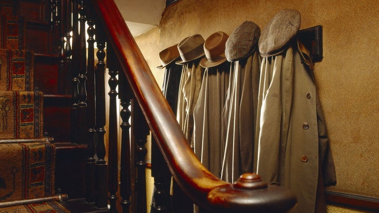William Sr's, William Jr's & Walter's coats hang in the hallway